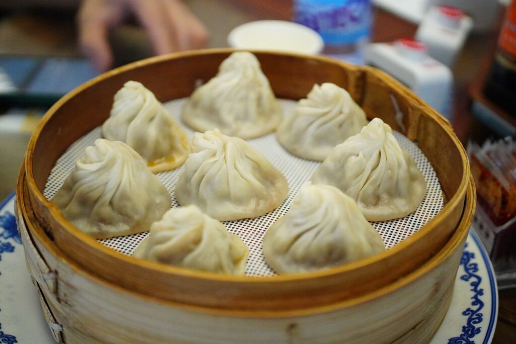pexels-photo-32034410-32034410 Delicious steamed dumplings served in a bamboo basket, perfect for a traditional Chinese meal.